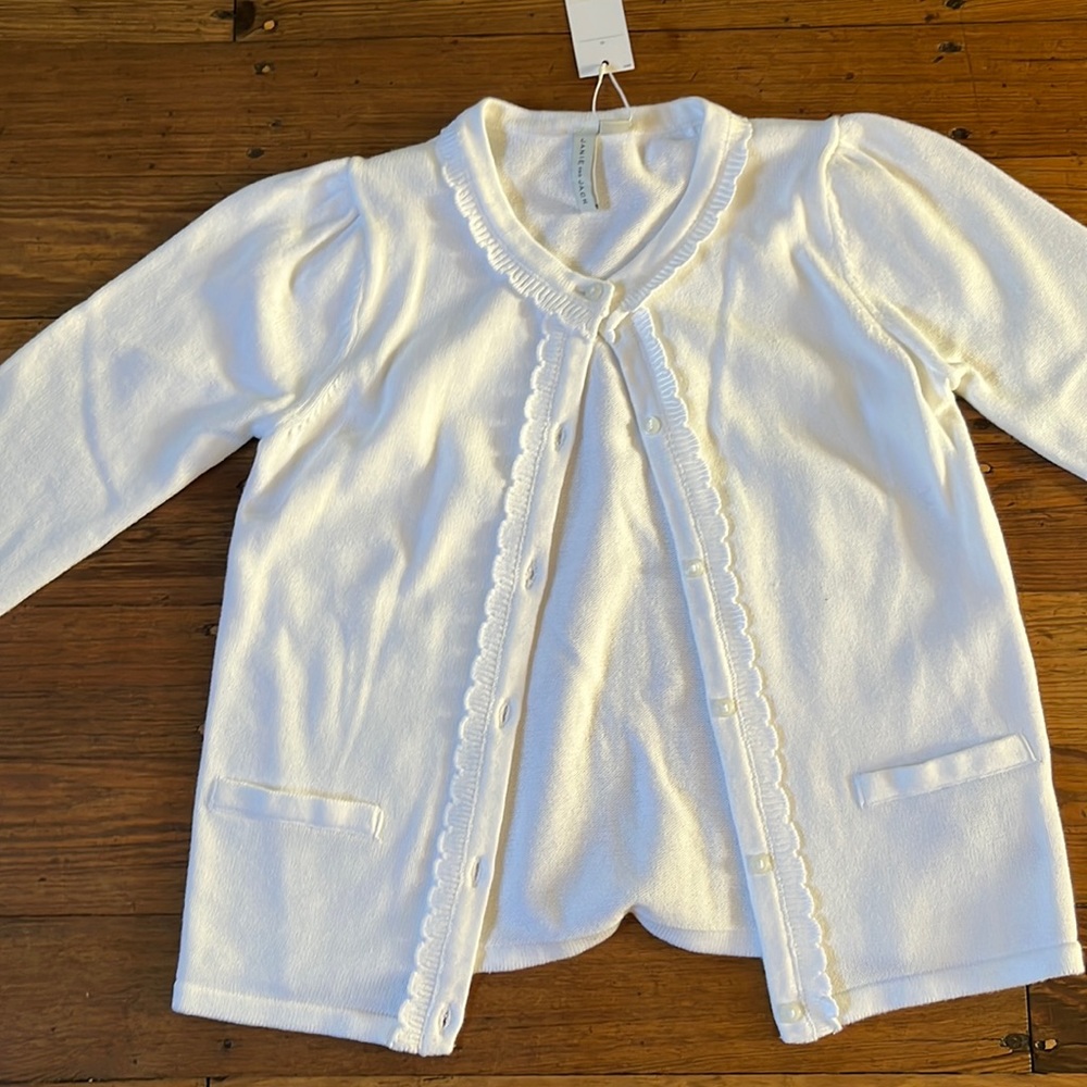 Girls white button down cardigan with scalloped neckline from Janie and Jack.